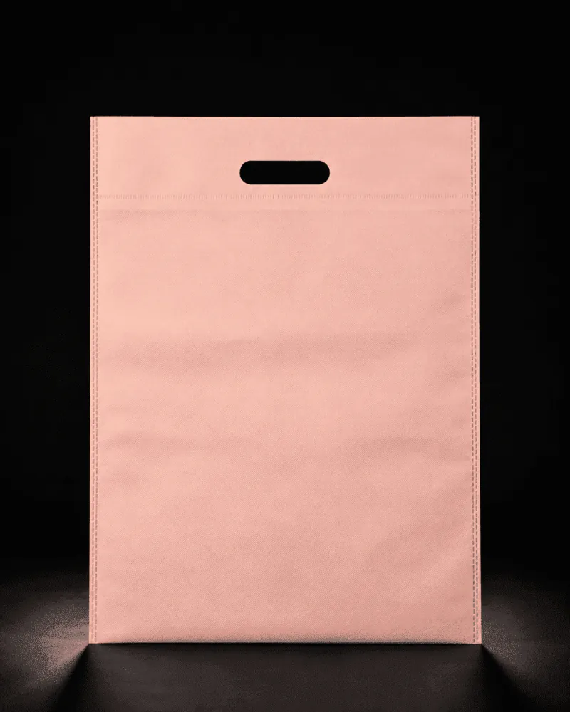 Baby pink D-Cut non-woven carry bag with custom logo printing by Vaibhav Enterprise