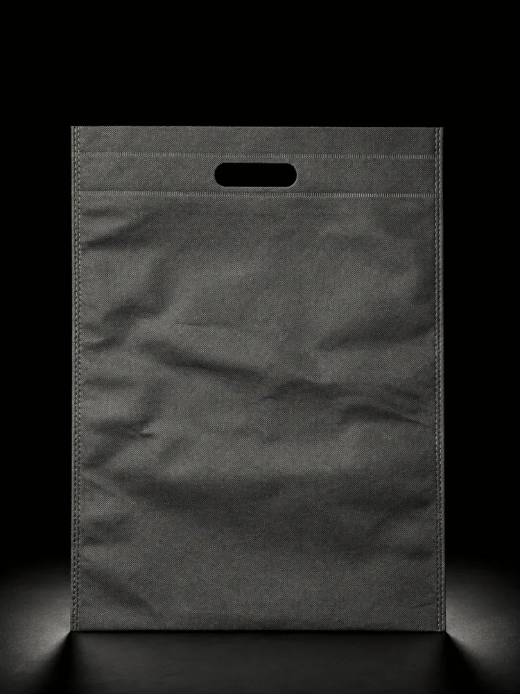 Black D-Cut non-woven carry bag with custom logo printing by Vaibhav Enterprise