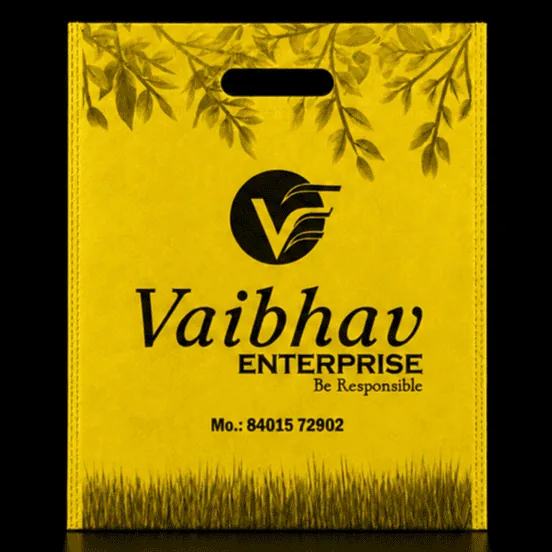 Yellow D-Cut non-woven carry bag with custom logo printing by Vaibhav Enterprise