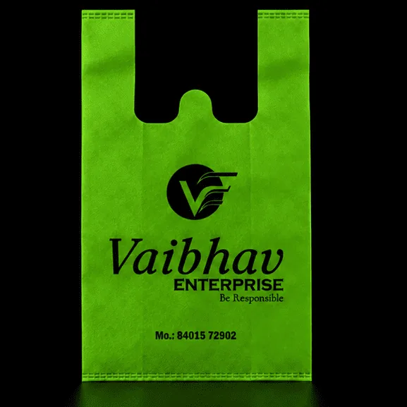 Green W-Cut non-woven carry bag with custom logo printing by Vaibhav Enterprise