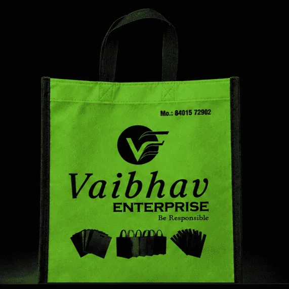 Green Stitched non-woven carry bag with custom logo printing by Vaibhav Enterprise