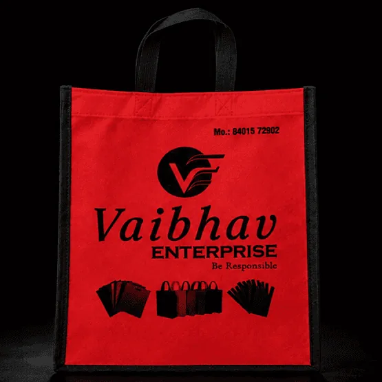 Red Stitched non-woven carry bag with custom logo printing by Vaibhav Enterprise